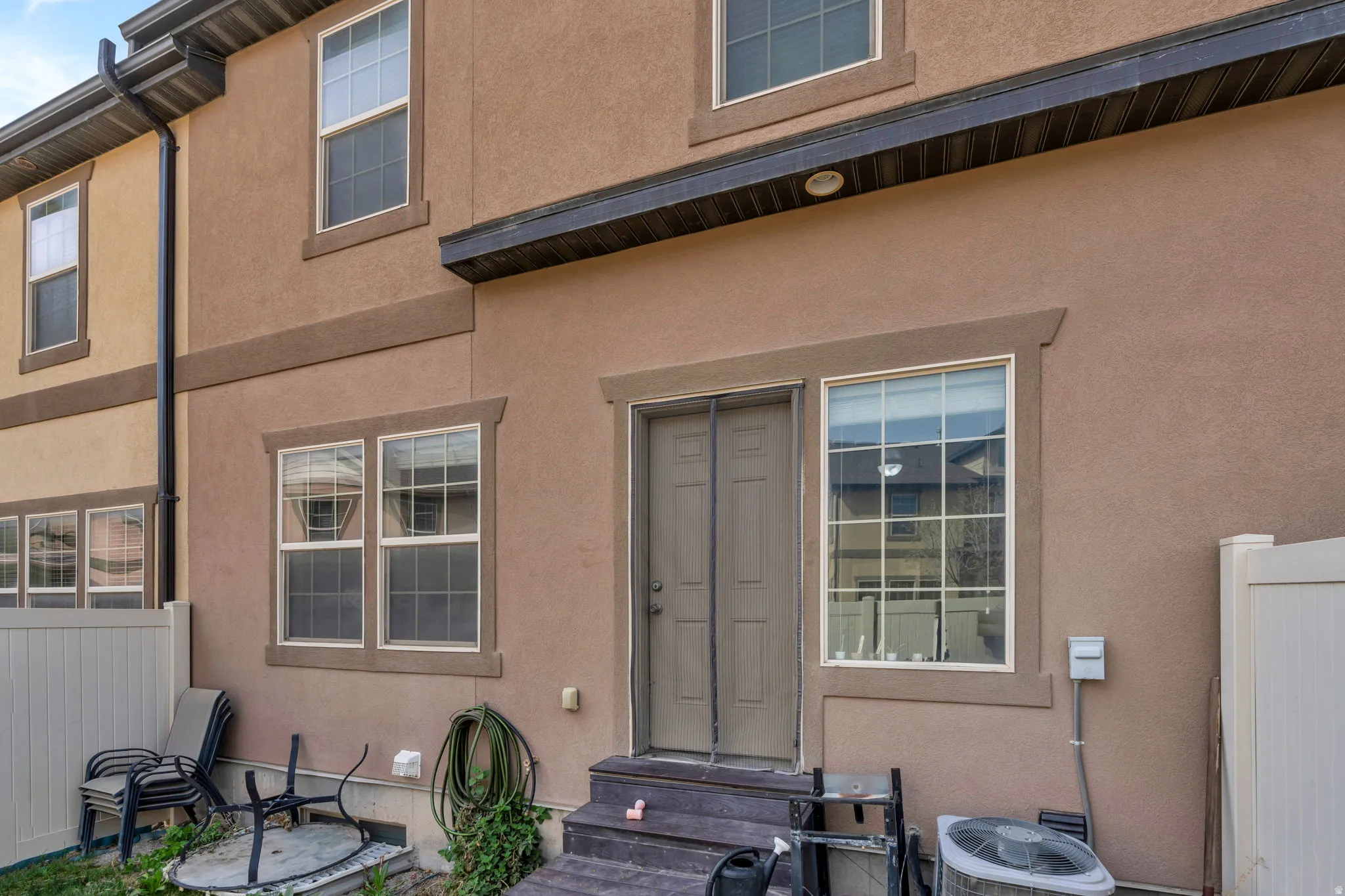 View of exterior entry featuring stucco siding