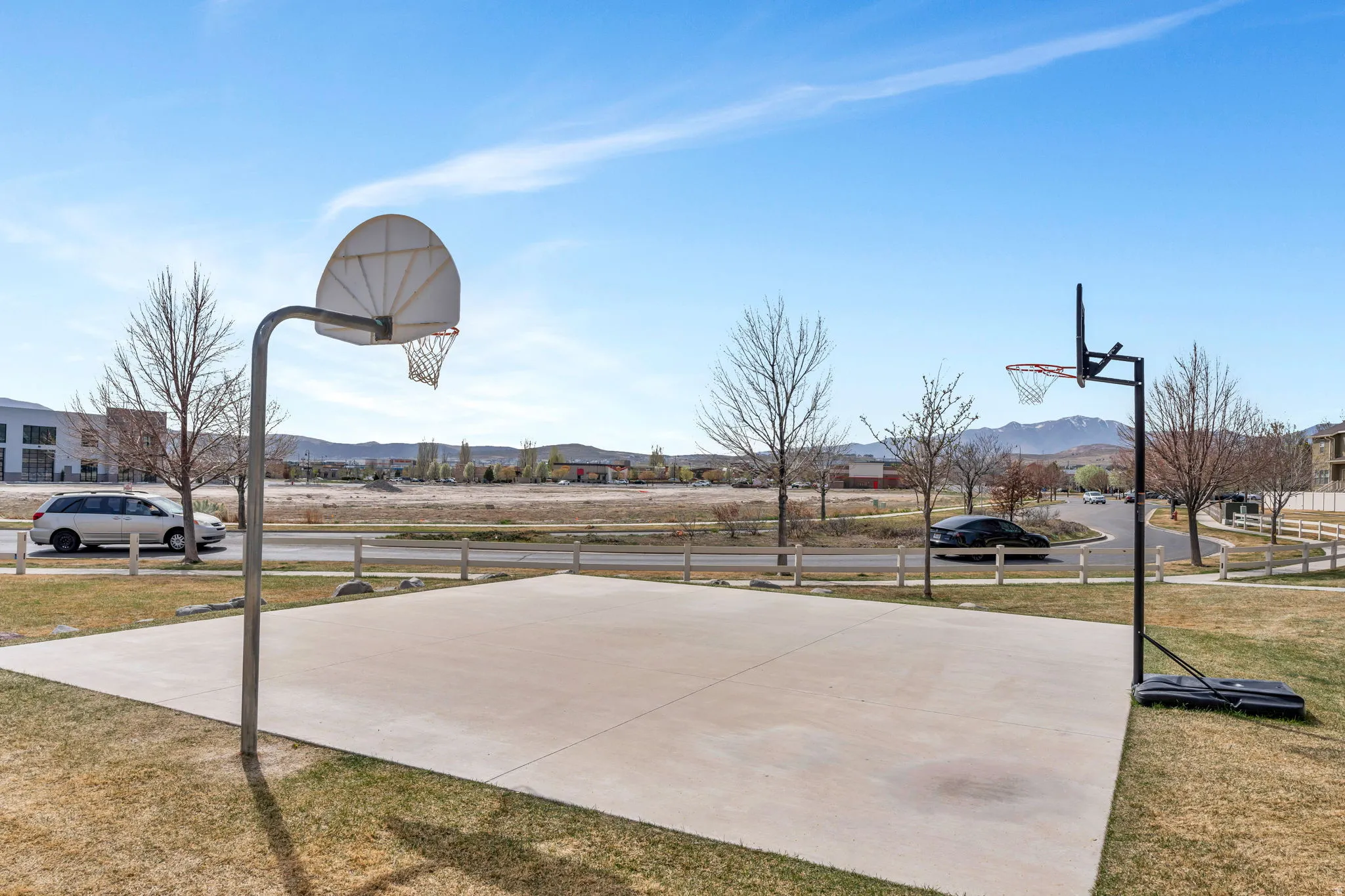 View of basketball court featuring community basketball court, a mountain view, and a residential view