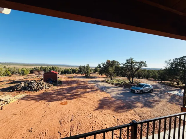 View of yard featuring a view of countryside and an outdoor structure