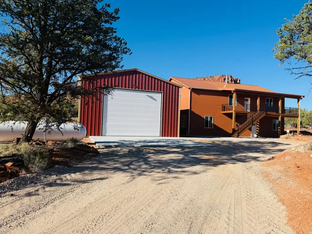 Detached garage featuring driveway