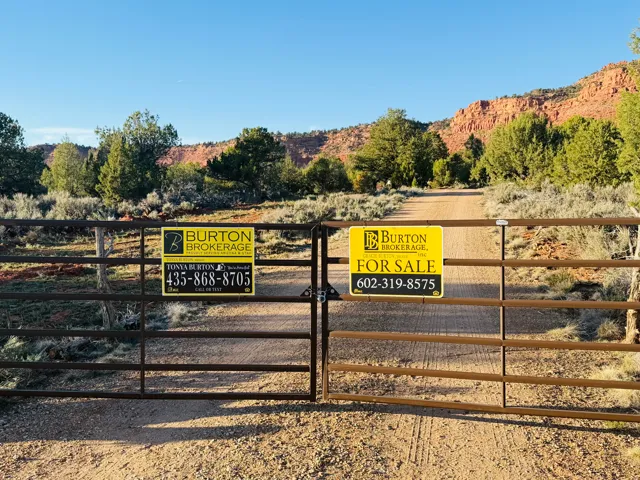 Exterior view of a gate and a mountainous background