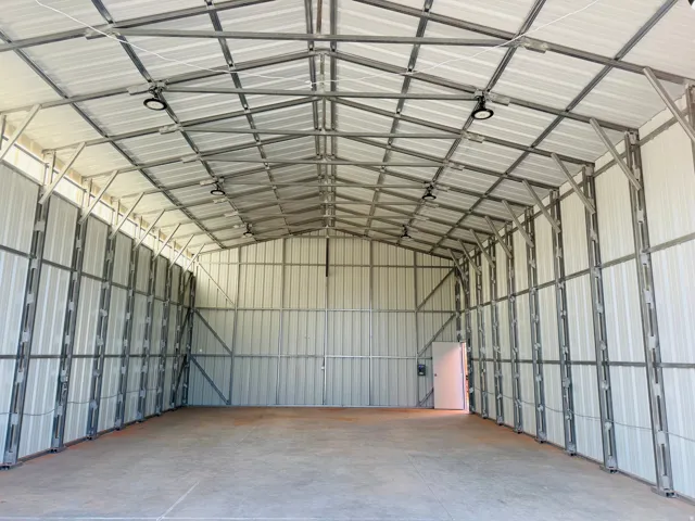 Garage featuring metal wall