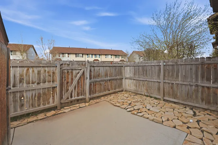 Fenced in Patio with Gate to Large Green Area
