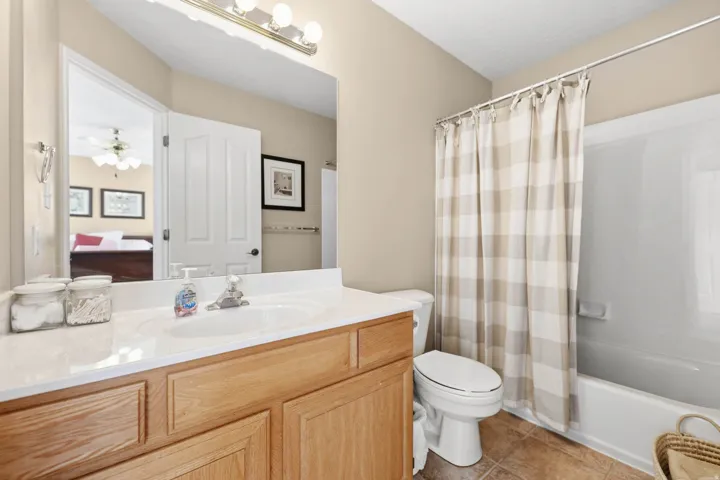 Primary Suite Bathroom with Large Vanity & a Tub & Shower