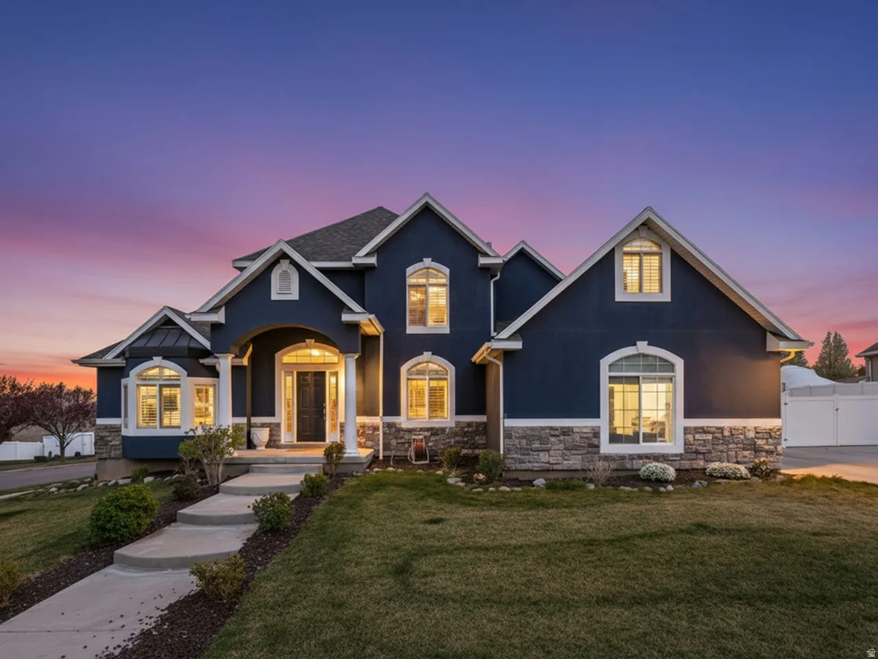 Craftsman-style house featuring stone siding and stucco siding