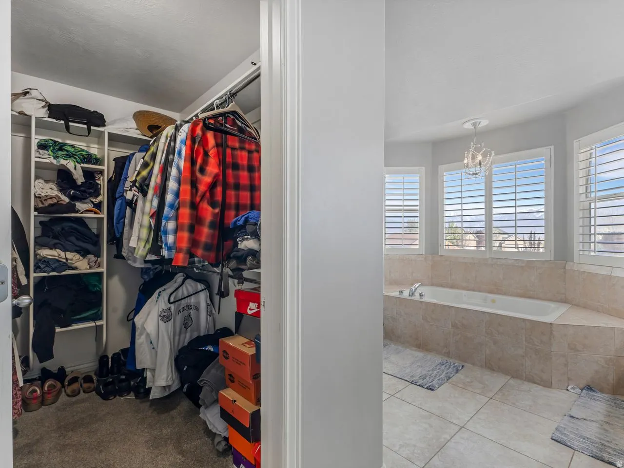 Walk in closet featuring light tile patterned flooring