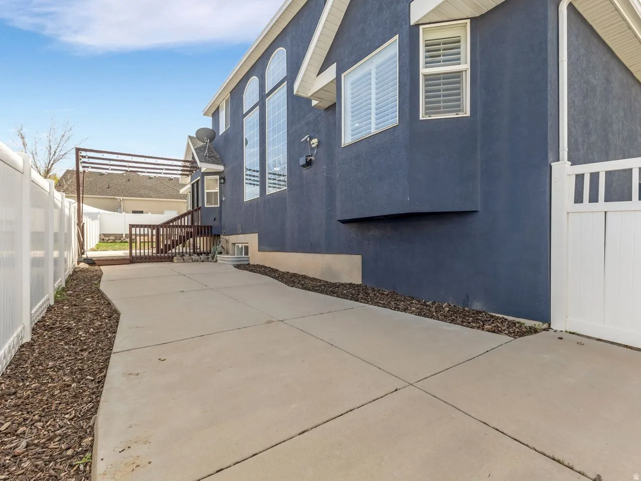View of side of property with stucco siding