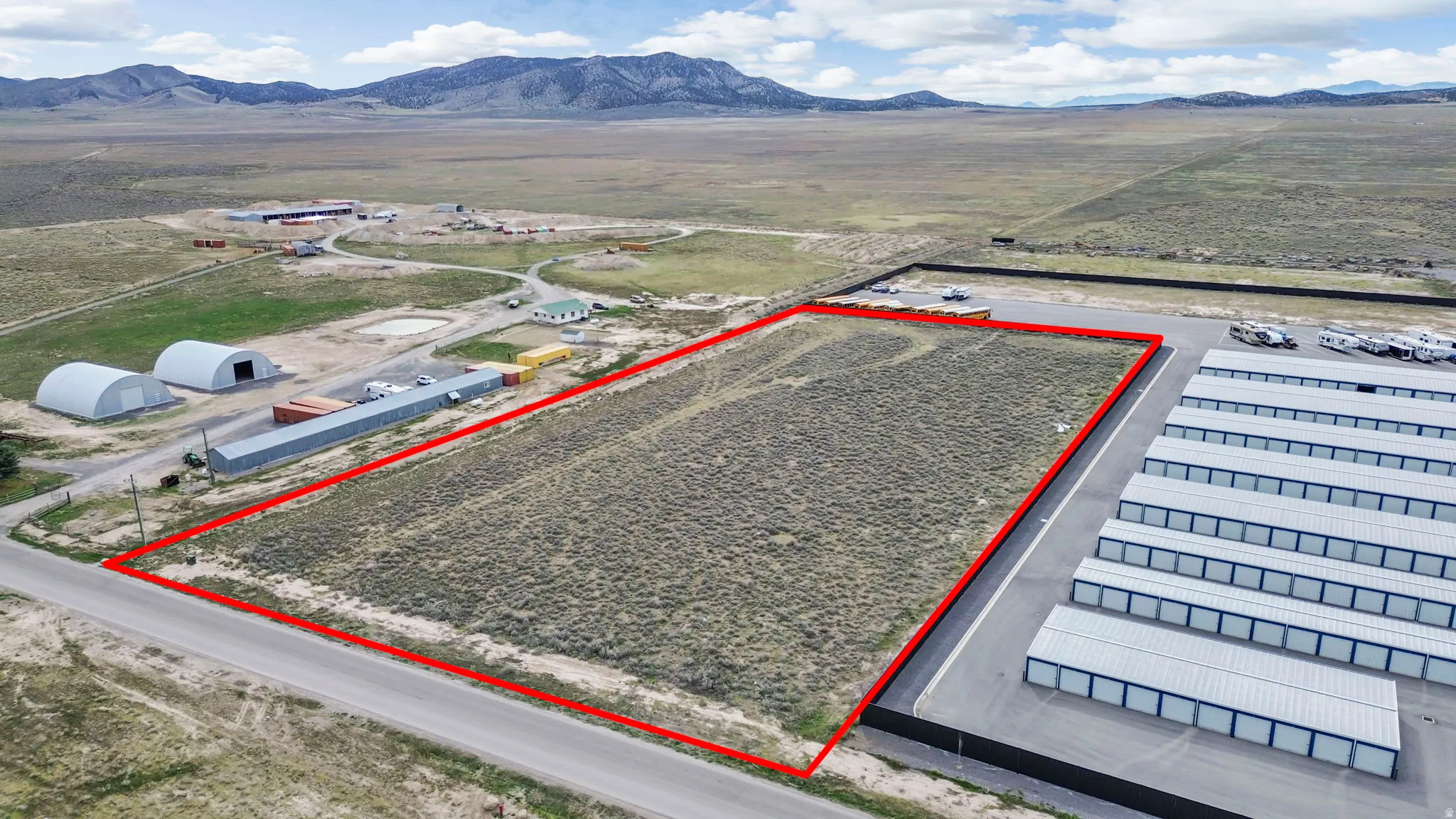 Overview of rural landscape featuring property parcel outlined and mountains