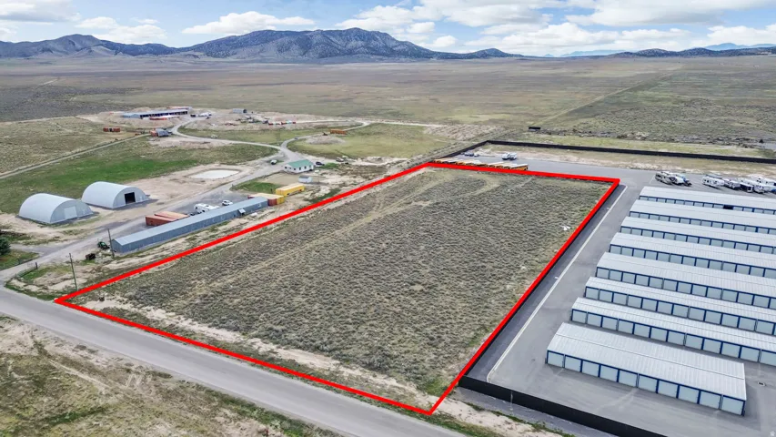Overview of rural landscape featuring property parcel outlined and mountains