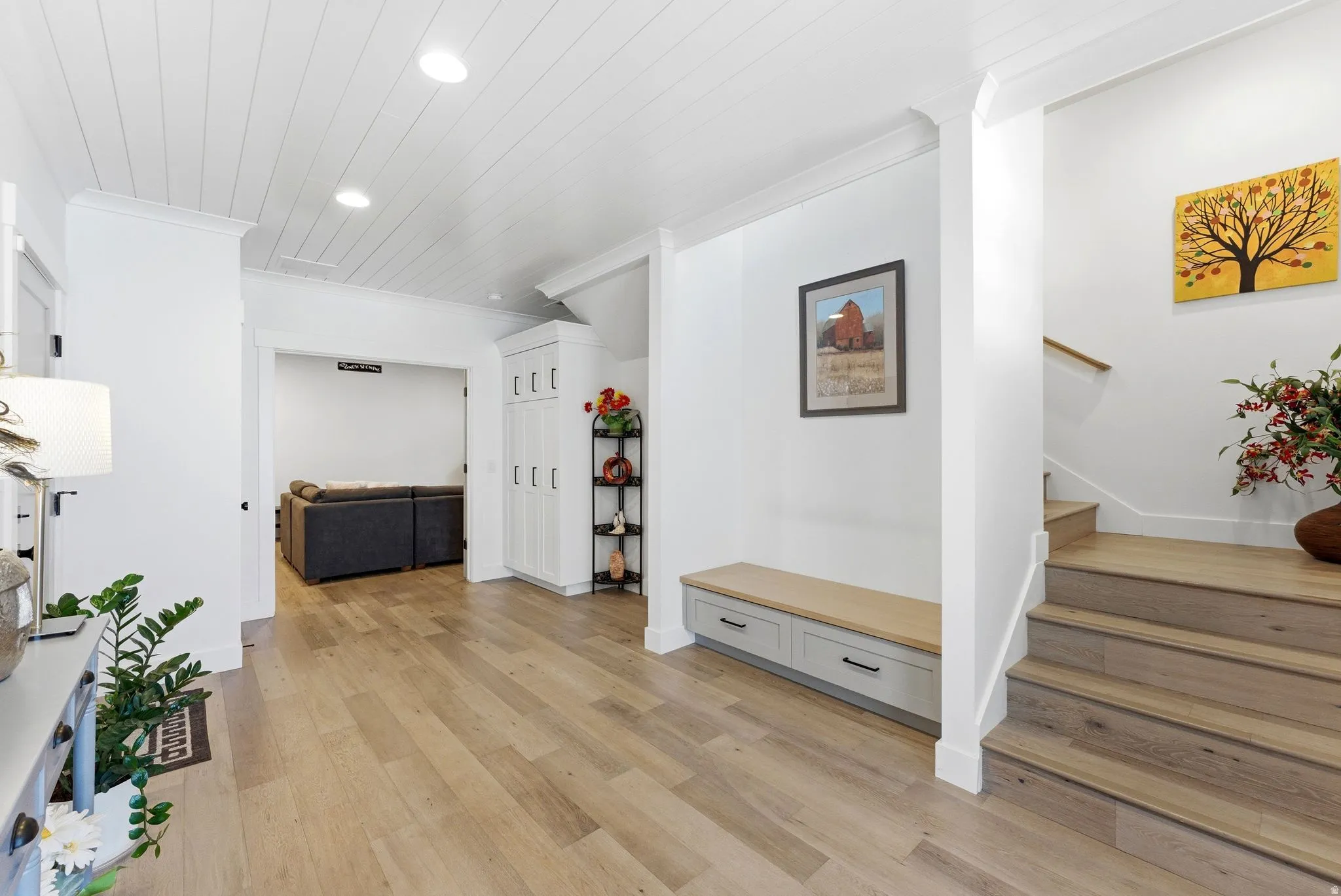 Hall featuring light wood-type flooring, recessed lighting, and crown molding