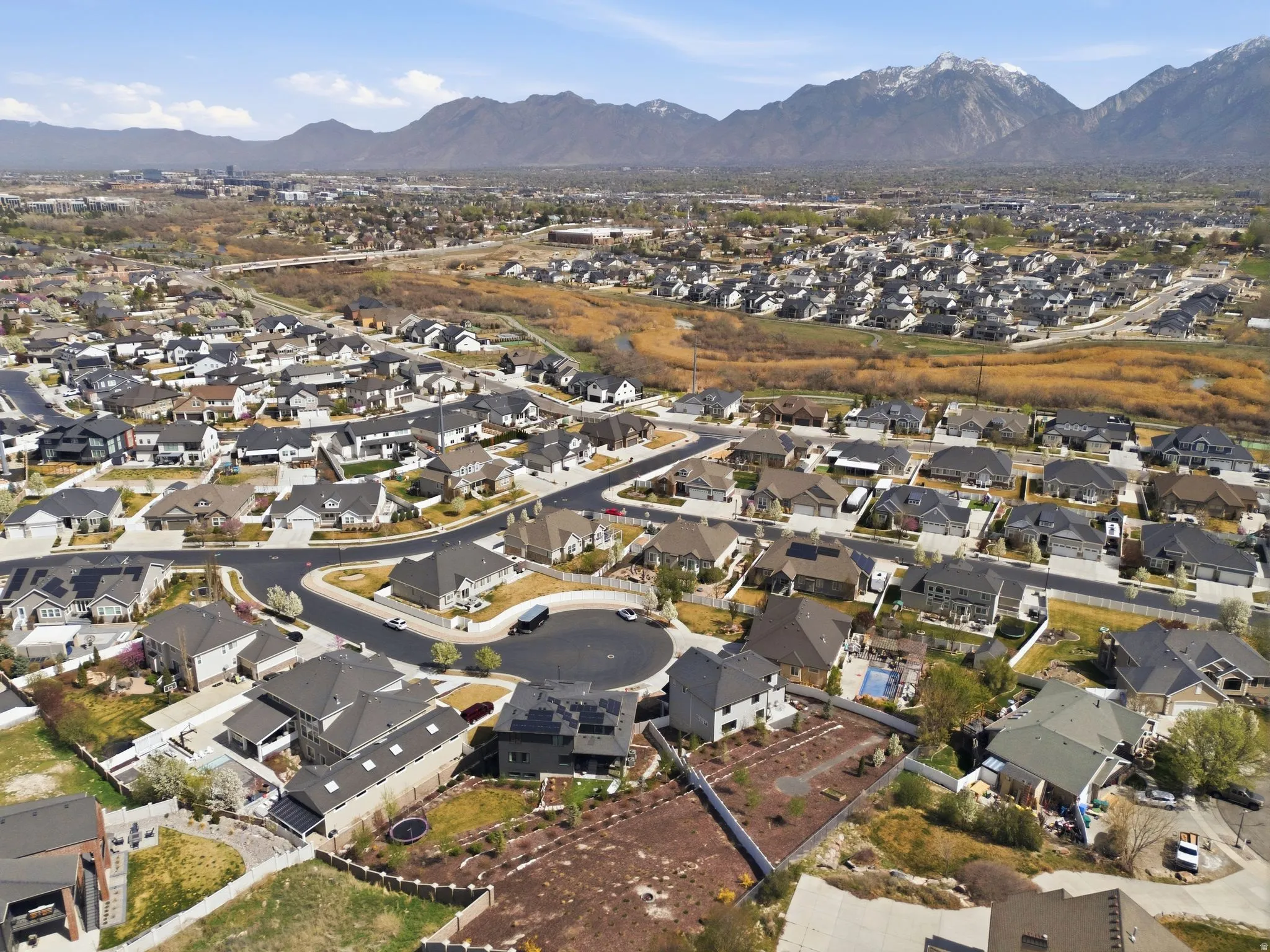 View of property location with a mountainous background and nearby suburban area