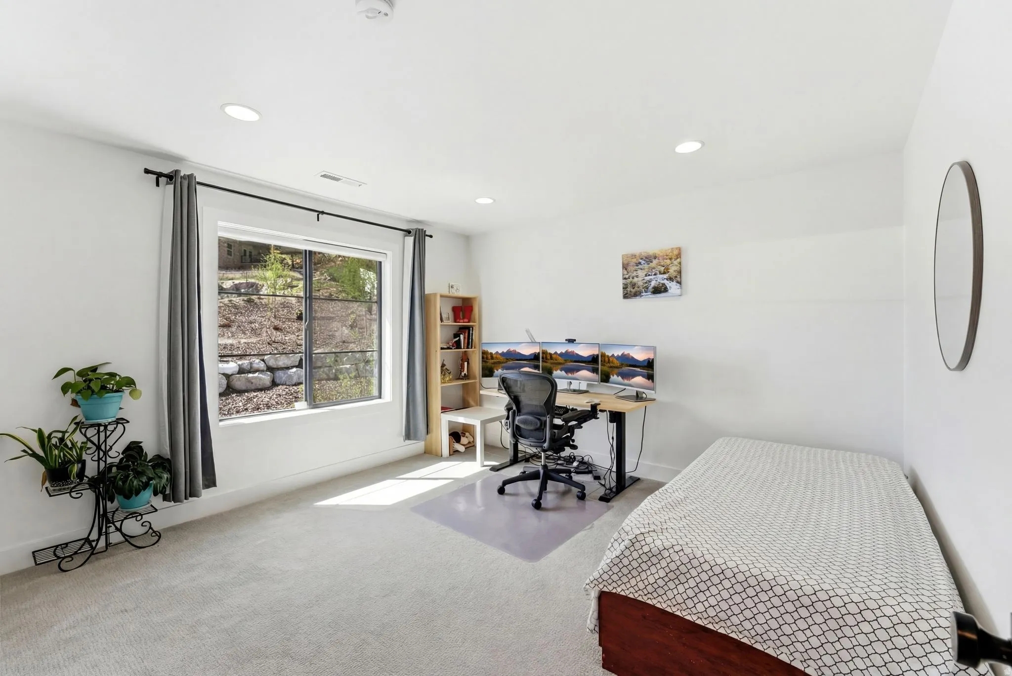 Carpeted bedroom with a desk and recessed lighting