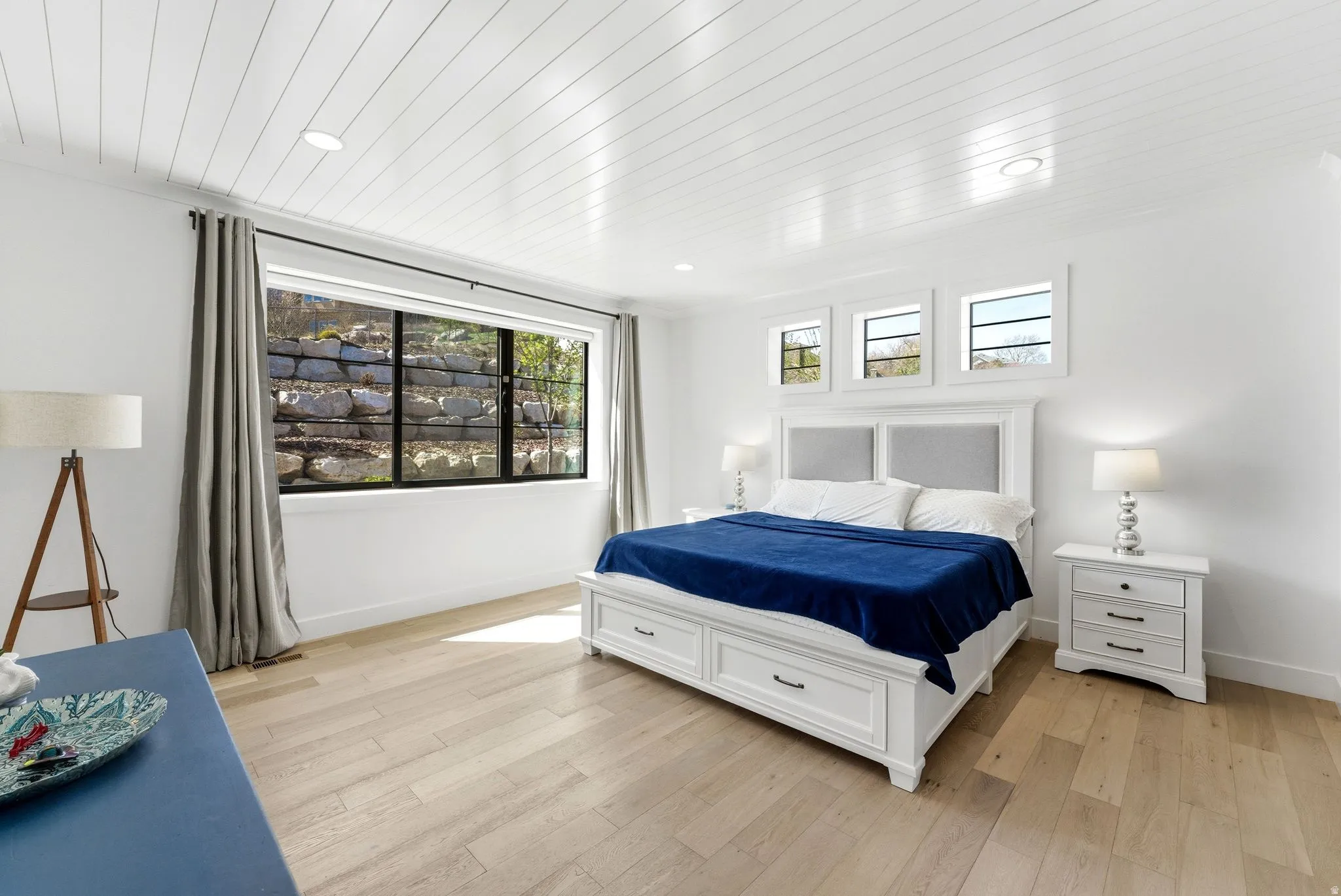 Bedroom featuring light wood-type flooring, wood ceiling, and recessed lighting