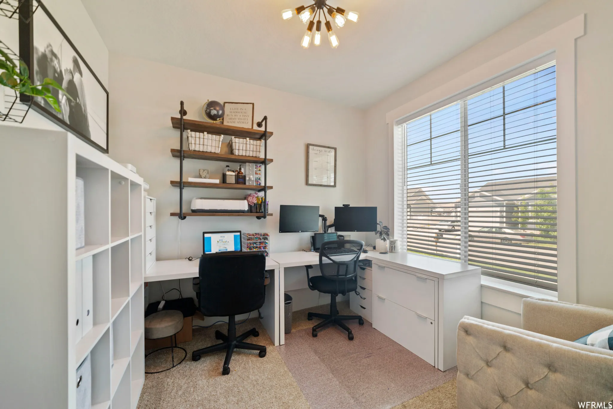 Home office featuring hanging lights