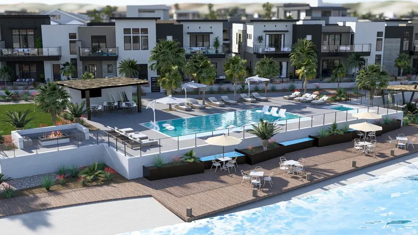 Community pool with a patio area and outdoor dining area