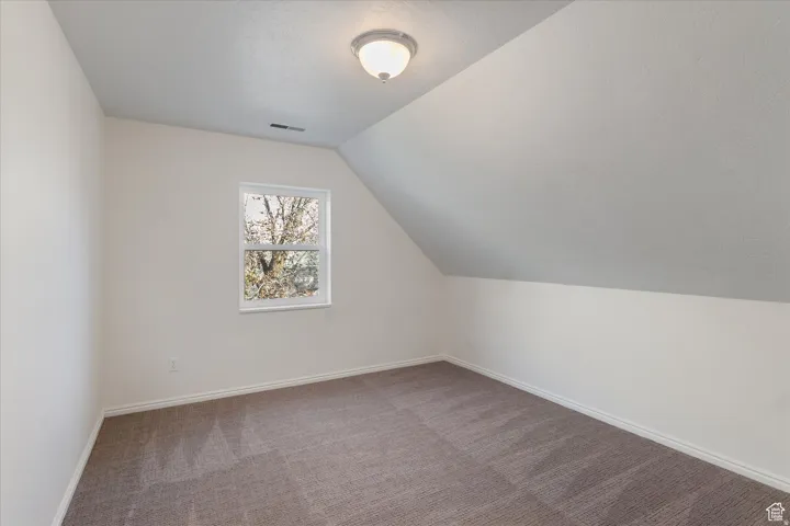 Bedroom room with carpet and baseboards