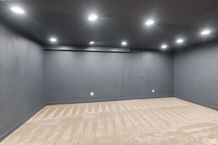 Spare room with recessed lighting dark walls and TV outlet perfect for a quiet movie