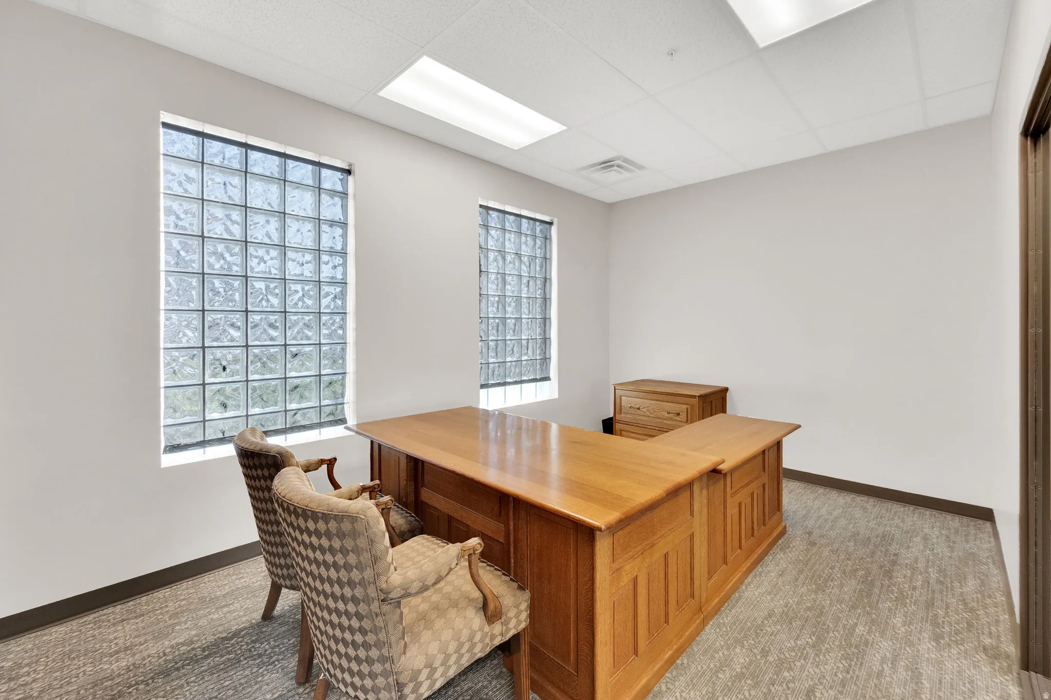 Office space featuring a drop ceiling