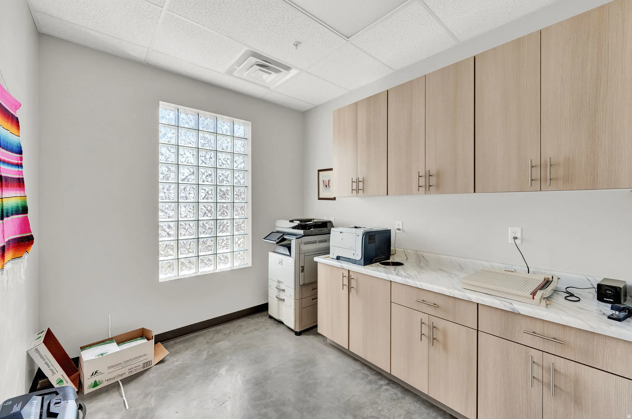Laundry area featuring a paneled ceiling and an office area