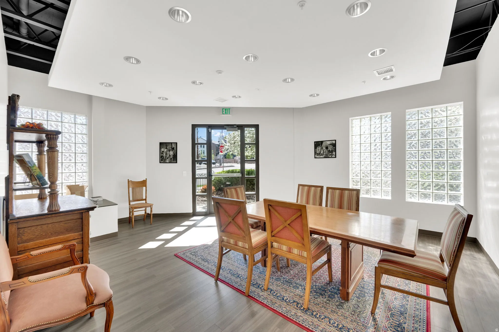 Dining area with healthy amount of natural light and wood finished floors