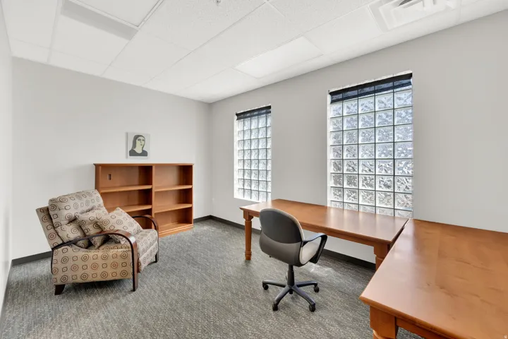Office with a paneled ceiling