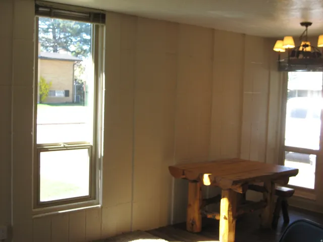 Dining space with plenty of natural light and a chandelier