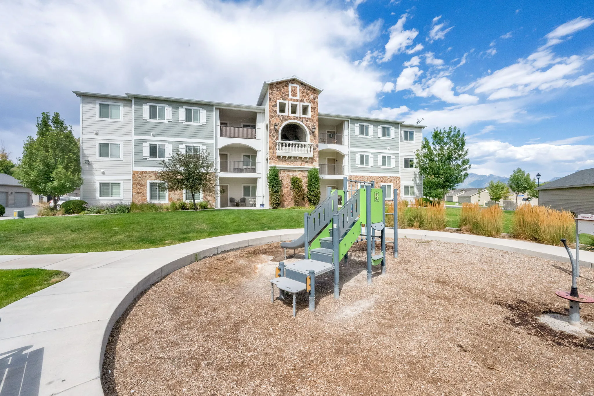 Community jungle gym with a lawn