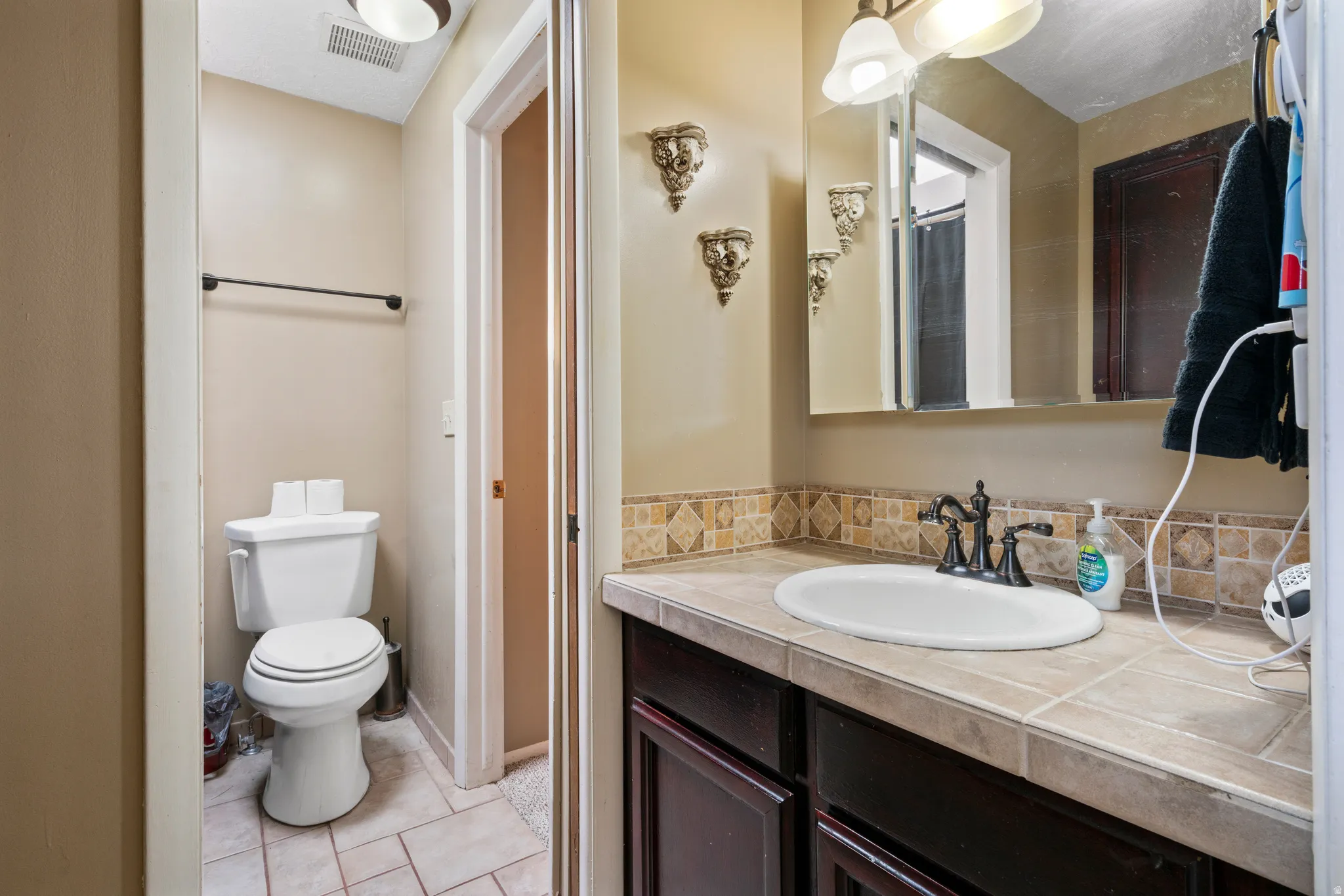 Bathroom with vanity and light tile patterned floors