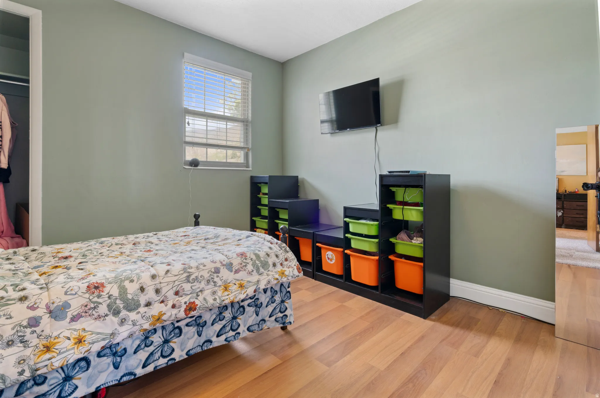 Bedroom featuring light wood finished floors and baseboards