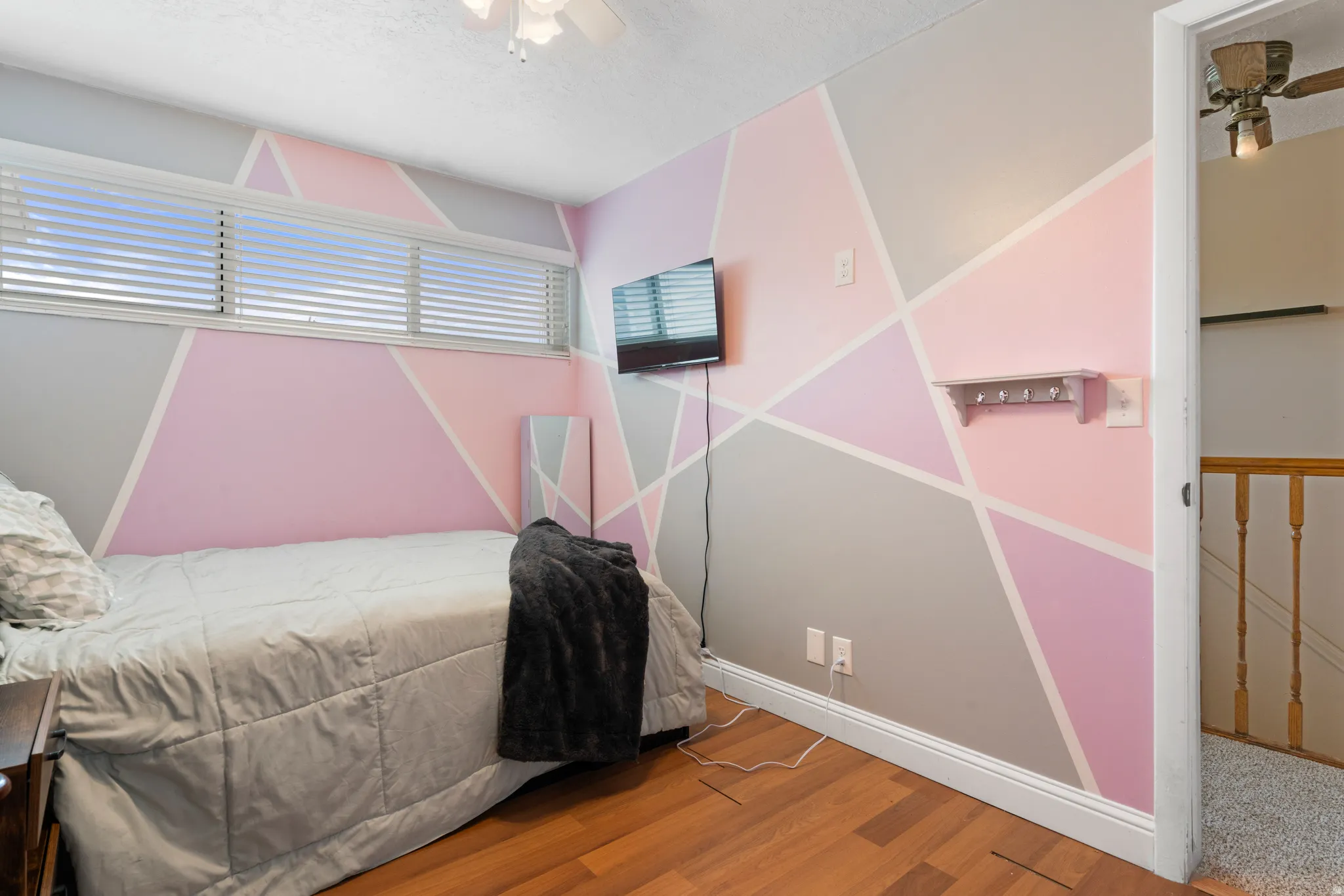 Bedroom featuring a ceiling fan and wood finished floors