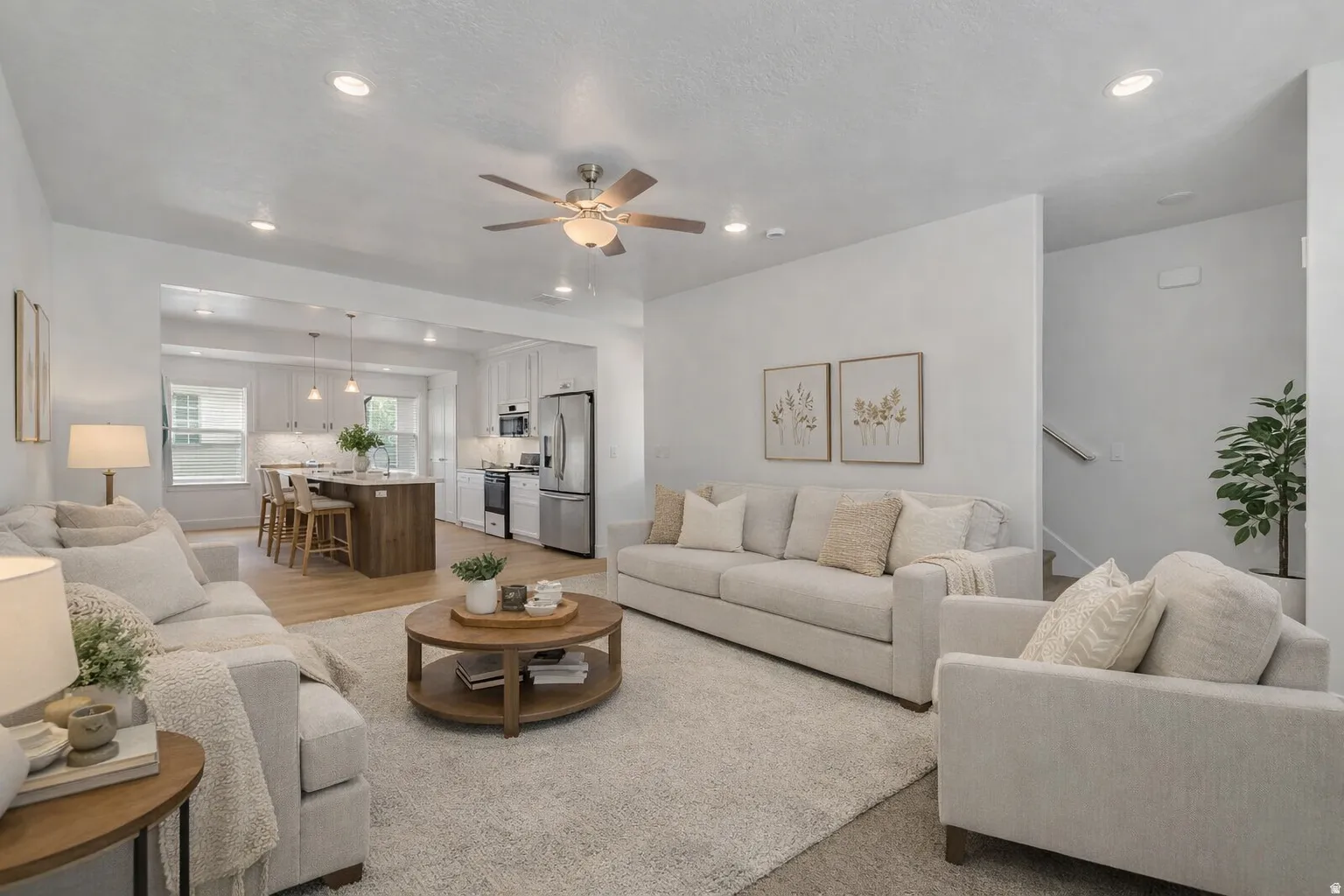 Open-concept main living area featuring recessed lighting and a ceiling fan