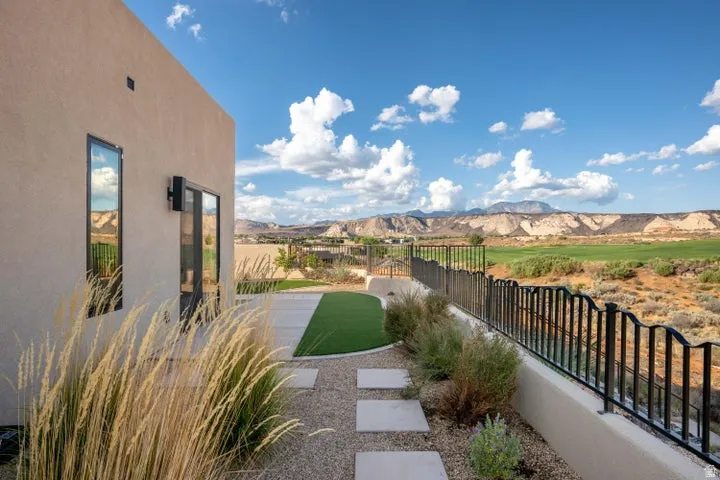 Fenced backyard featuring a mountain view