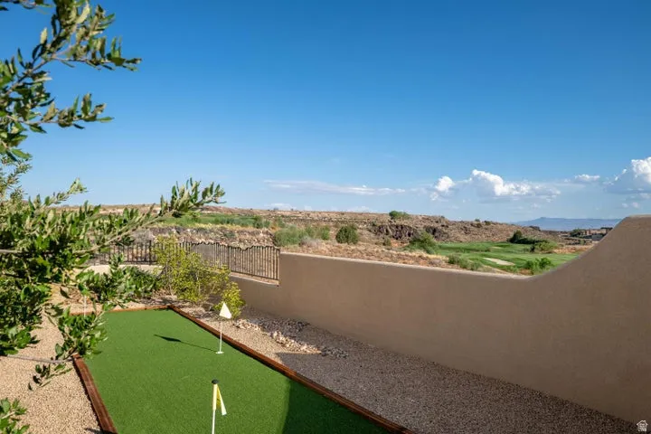View of yard featuring an area to practice putting