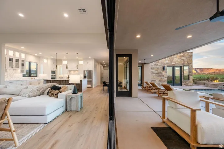 Living room with recessed lighting, french doors, and light wood finished floors