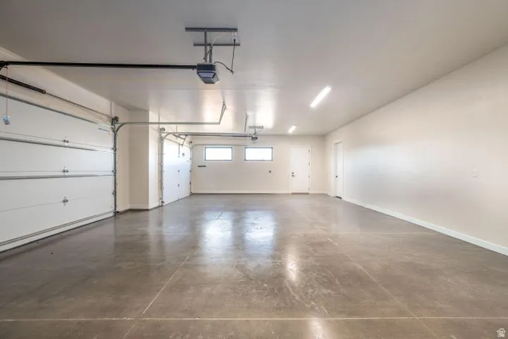 Garage featuring baseboards