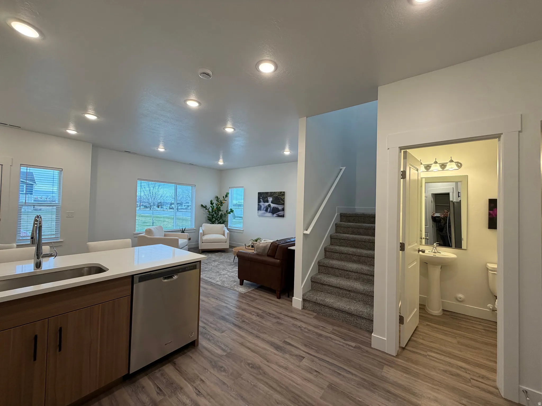 A peek into the main-floor half bath right off the kitchen with access to main-floor living area
