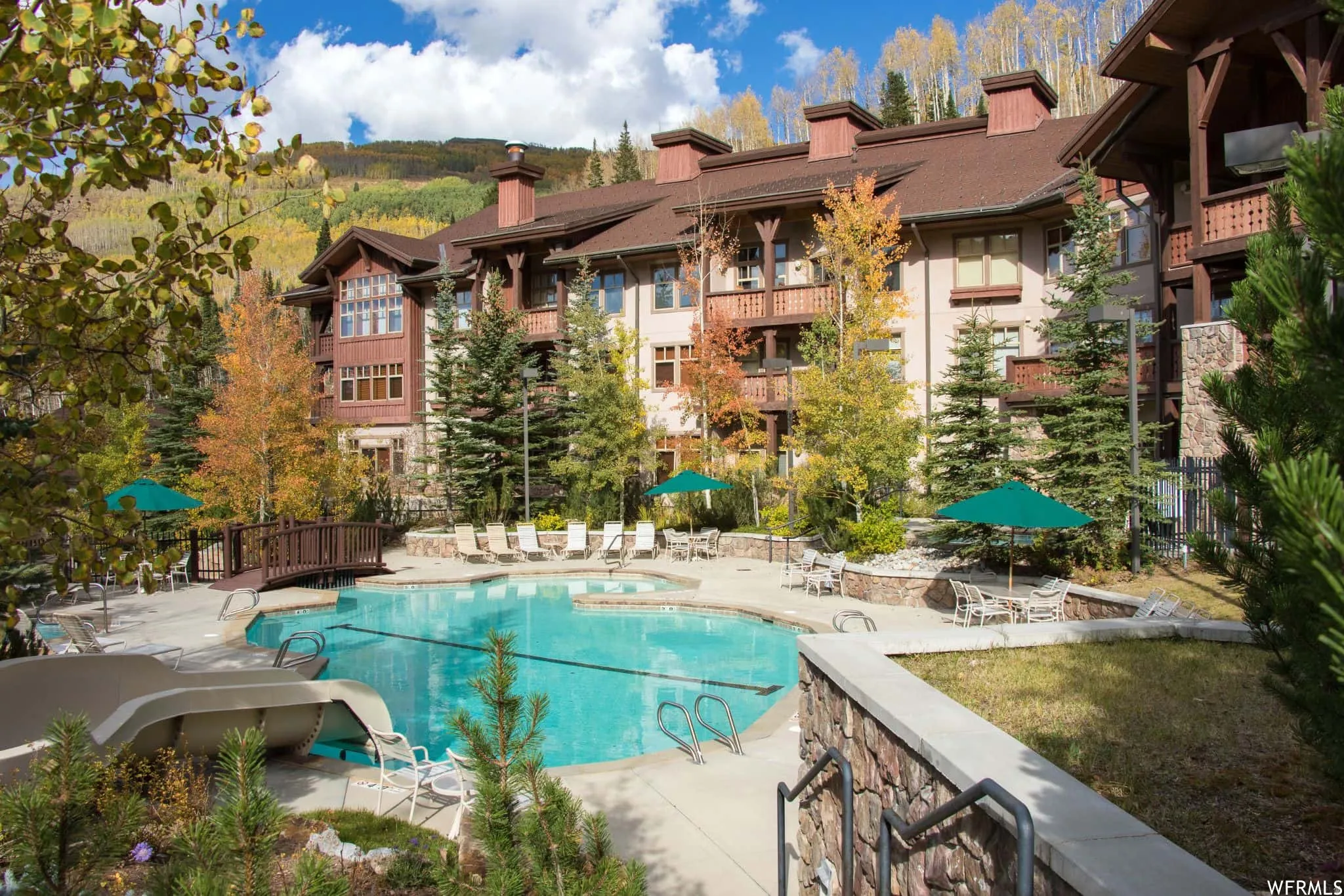 Community pool featuring a patio