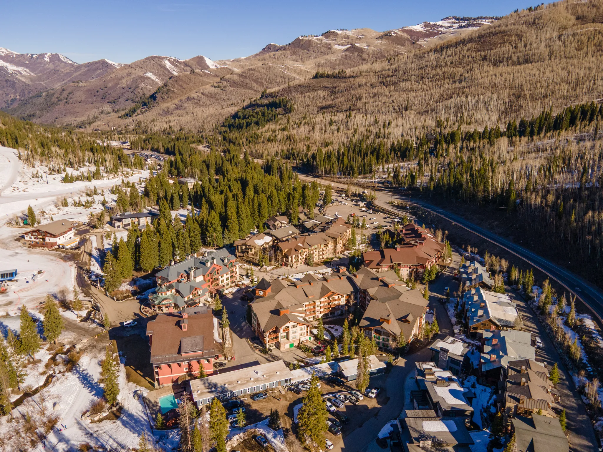 View of property location featuring mountains and a forest