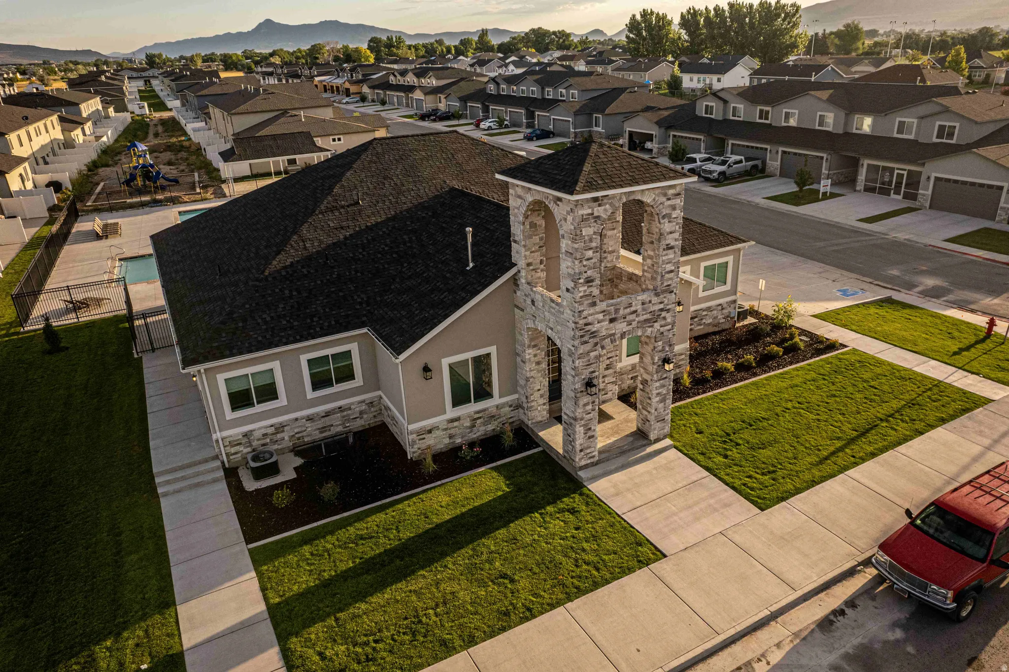 Aerial view at dusk of a residential view and a mountain view