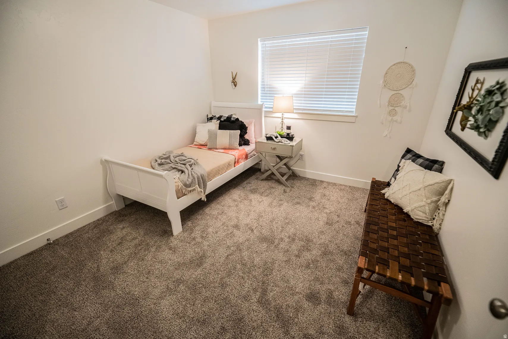 Carpeted bedroom with baseboards