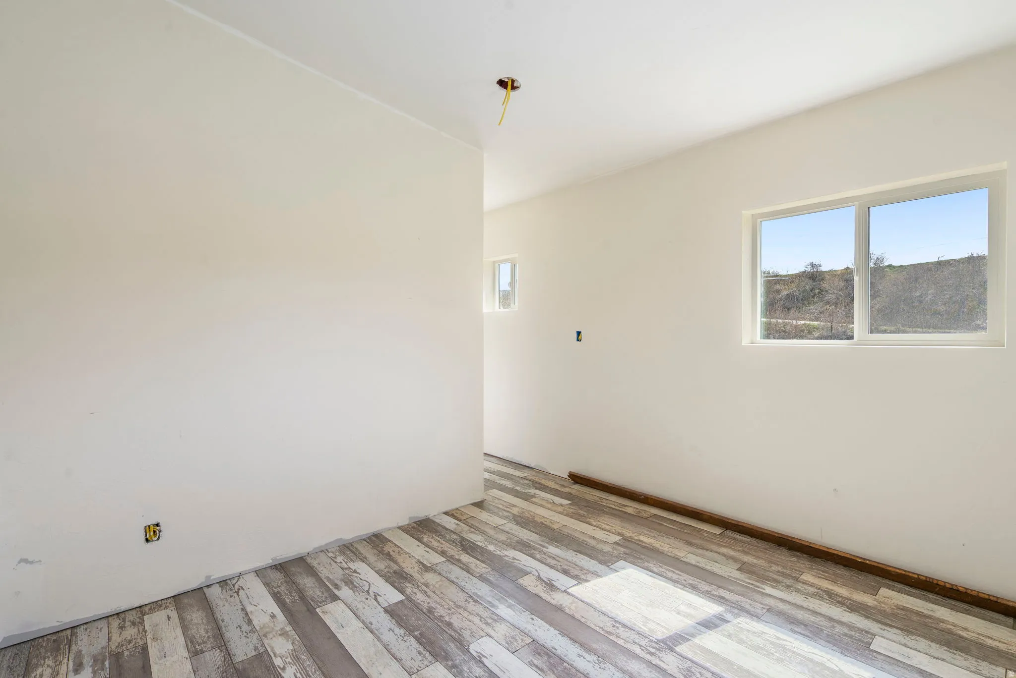 Unfurnished room with light wood finished floors