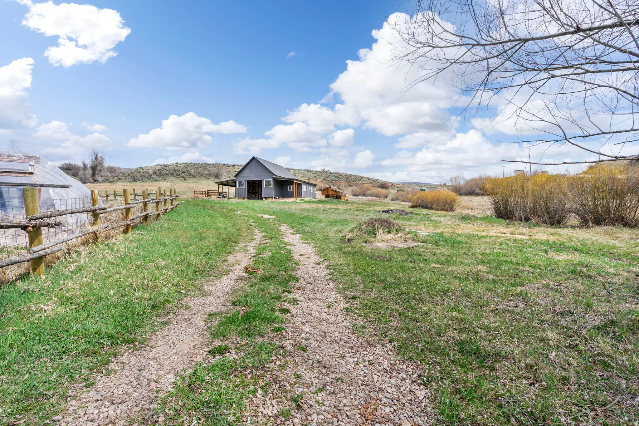 View of yard with a view of rural / pastoral area and an outdoor structure