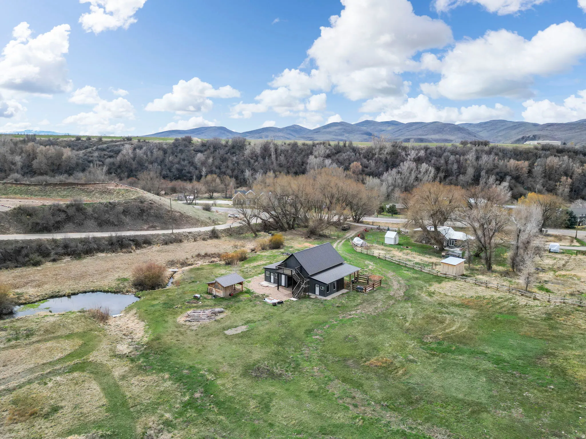 View of subject property featuring a water and mountain view
