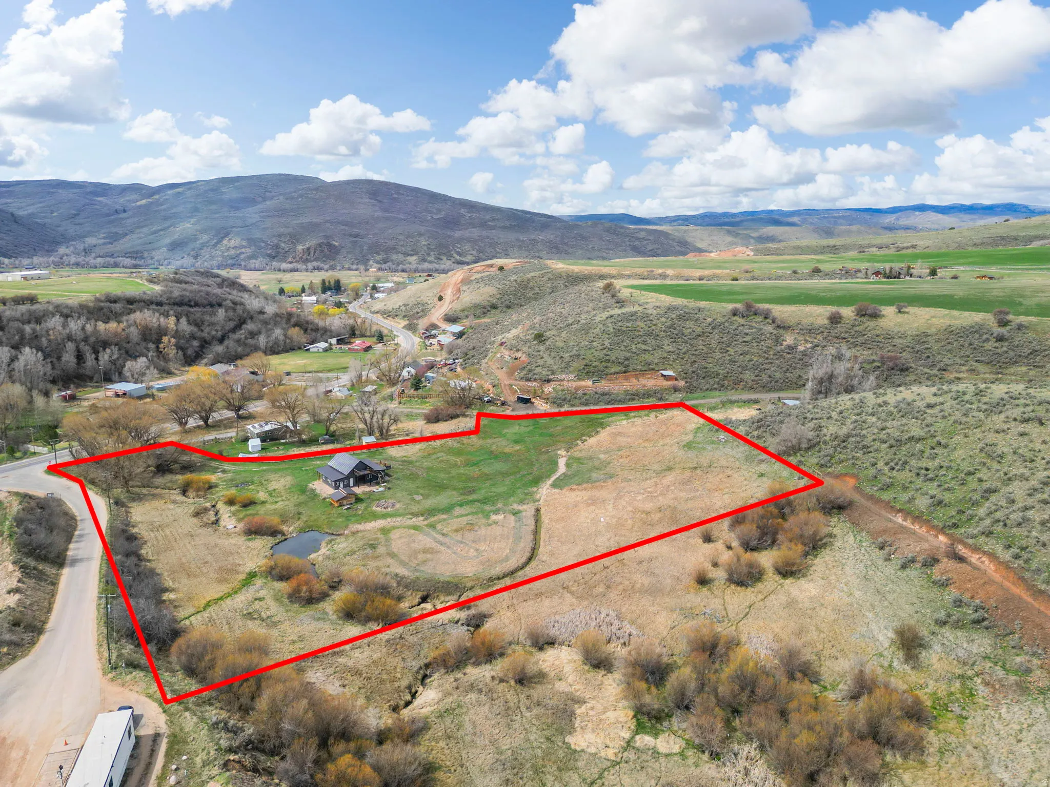 View of rural area featuring property boundaries highlighted and a mountain backdrop