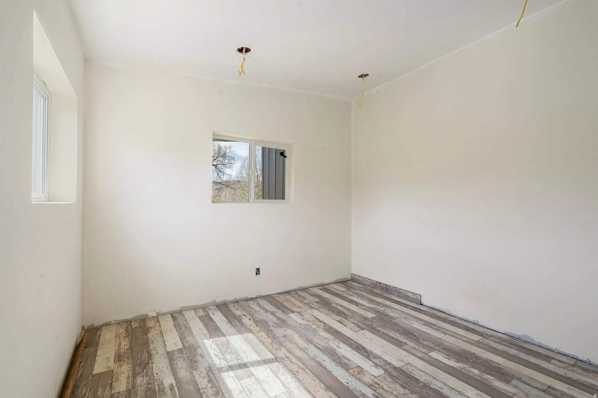 Spare room with light wood-style flooring