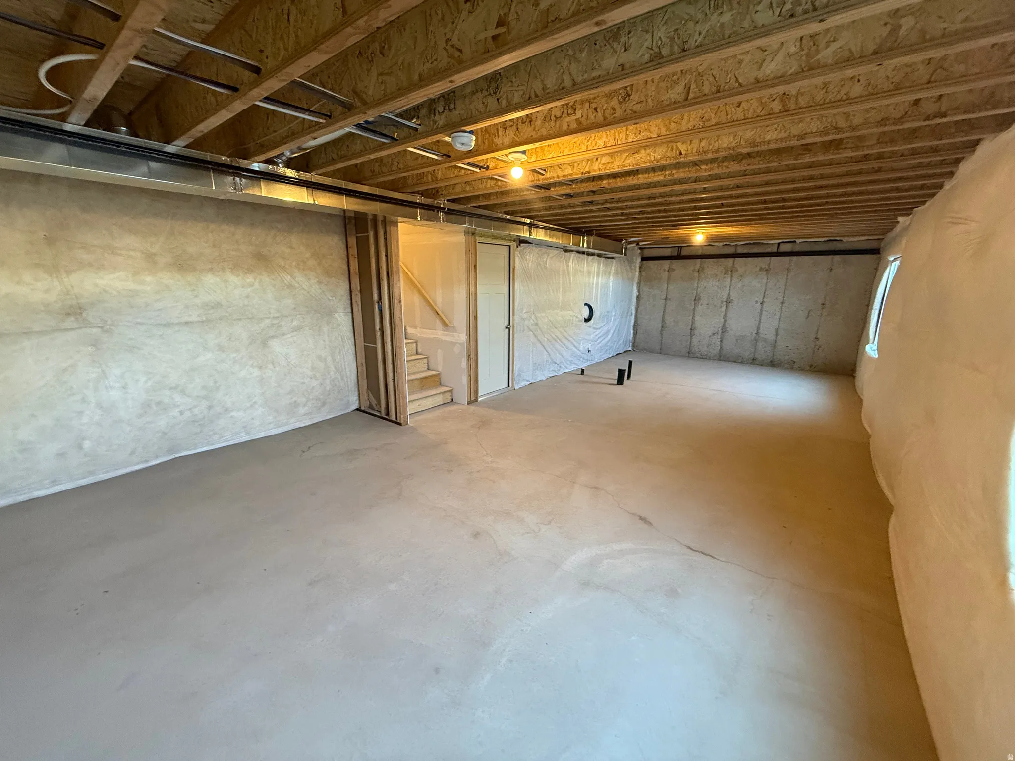 Unfinished basement with stairway