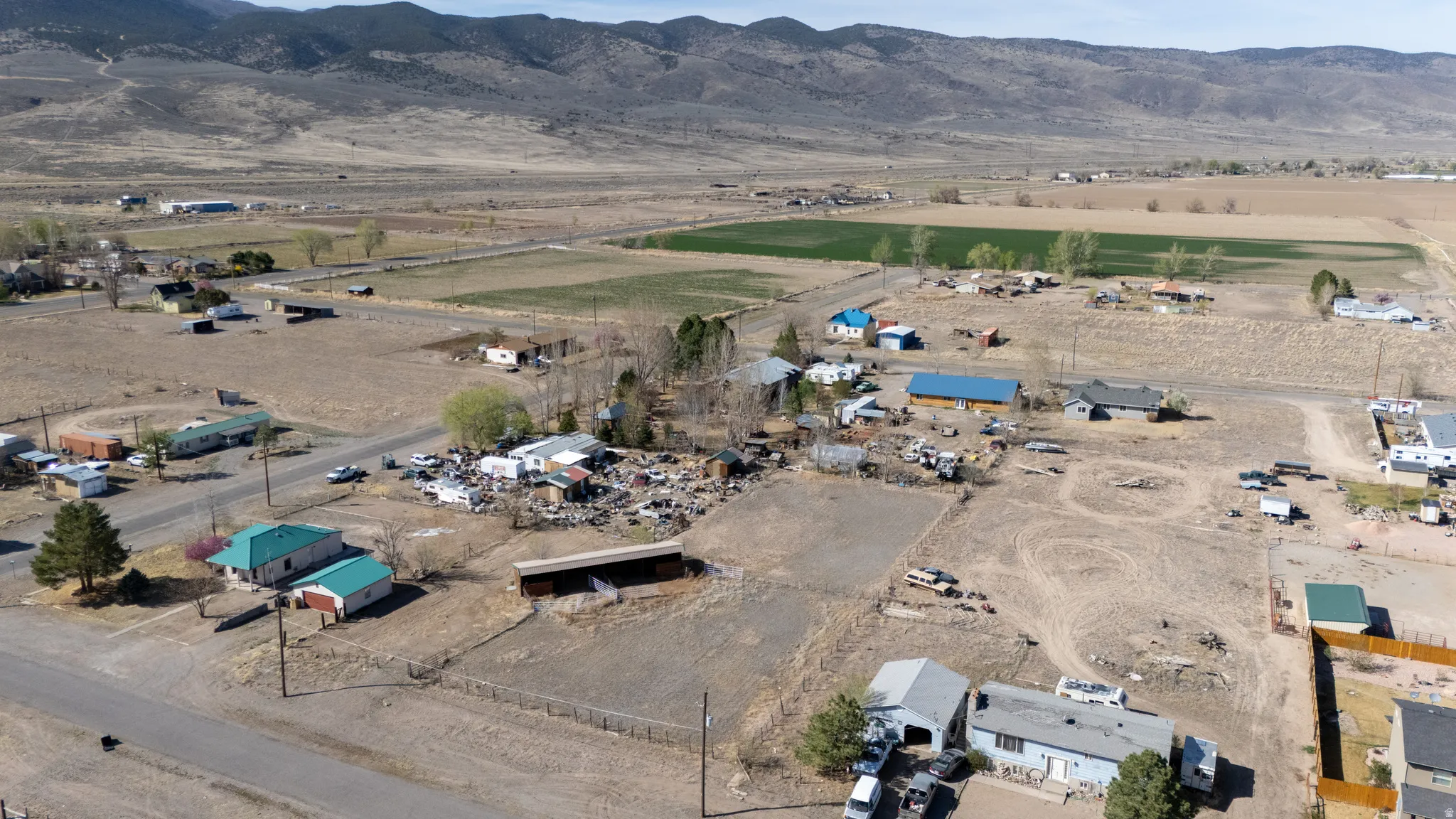 Aerial view of property and surrounding area with rural landscape and mountains