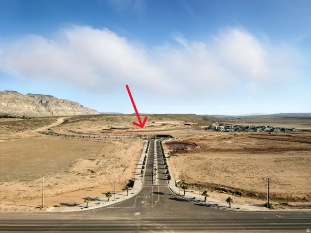 Aerial view of the North Slope entry in relation to the lot, featuring a mountainous background