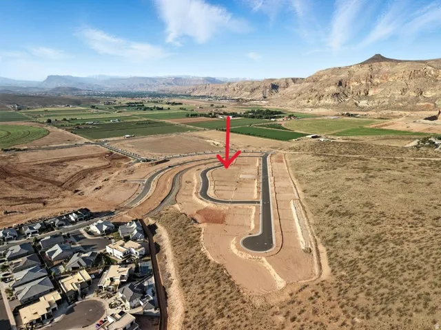 Aerial view of property and surrounding area with mountains in the background and Hurricane valley below