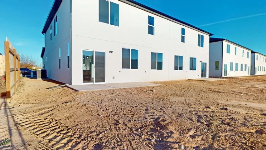 Back of property with a patio area